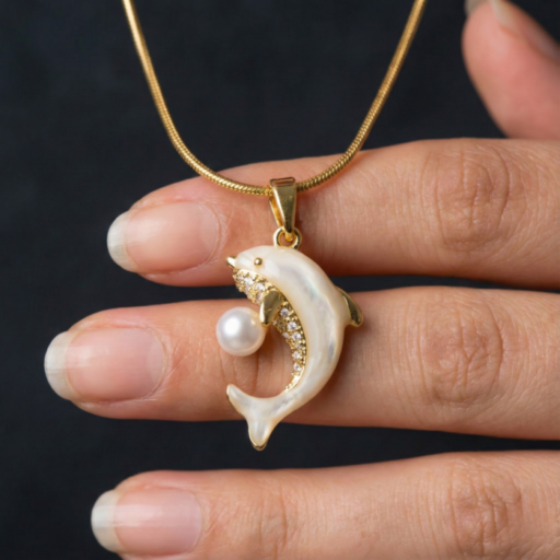 Gold Tone Dolphin Pendant Necklace – Mother of Pearl Look with Crystal Accents & Round Pearl Charm – Playful Ocean Themed Jewelry