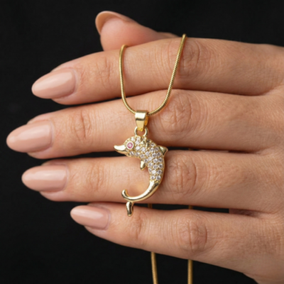 Gold Tone Crystal Dolphin Pendant Necklace – Pave CZ Body with Red Eye Accent on Snake Chain – Playful Ocean Animal Jewelry for Women