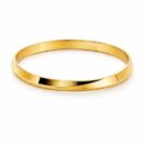 Define your look with a masterclass in geometric minimalism. This sleek gold-toned bangle features a striking knife-edge silhouette that transforms a classic accessory into a modern architectural statement.