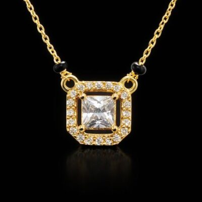Experience the perfect marriage of sacred symbolism and geometric precision. This gold-toned Mangalsutra features a striking princess-cut aesthetic, offering a bold and modern interpretation of a timeless tradition.