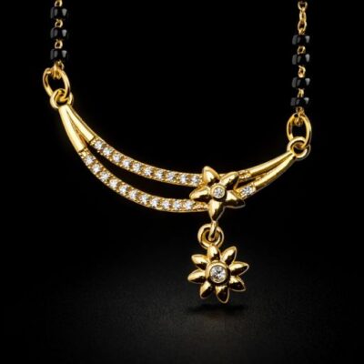 Embody the grace of tradition with a contemporary silhouette. This gold-toned Mangalsutra features a stunning curved bar design accented by delicate floral motifs, offering a poetic and sophisticated take on a sacred symbol.