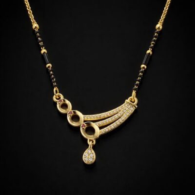 Blending artisanal geometry with a hint of royal color, this gold-toned Mangalsutra offers a fresh, modern perspective on traditional jewelry. Its unique asymmetric design and delicate sparkle make it a captivating signature piece.
