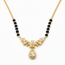 Embrace the radiance of a blooming garden with this gold-toned Mangalsutra. Featuring a graceful wing-like arrangement of marquise crystals and a stunning halo drop, it is a sophisticated tribute to tradition with a high-fashion, floral aesthetic.