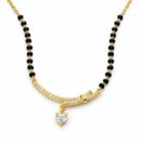 Combining the symbolism of an unbreakable bond with a contemporary silhouette, this gold-toned Mangalsutra features a stunning curved bar and a radiant heart charm. It is a poetic tribute to love, designed for the modern woman who values both tradition and trend.