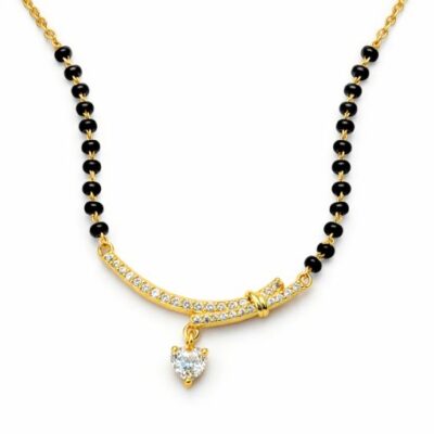 Combining the symbolism of an unbreakable bond with a contemporary silhouette, this gold-toned Mangalsutra features a stunning curved bar and a radiant heart charm. It is a poetic tribute to love, designed for the modern woman who values both tradition and trend.