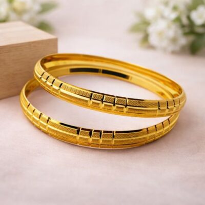 Elevate your daily attire with a masterclass in gold craftsmanship. These bangles feature a sophisticated interplay of textures, blending high-polish brilliance with intricate laser-cut detailing for a timeless yet modern aesthetic.