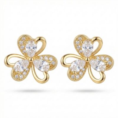 Celebrate a life of luck and beauty with these intricately detailed gold-toned studs. Designed with a poetic floral silhouette, these earrings combine the charm of a three-leaf clover with the high-wattage sparkle of fine-jewelry craftsmanship.