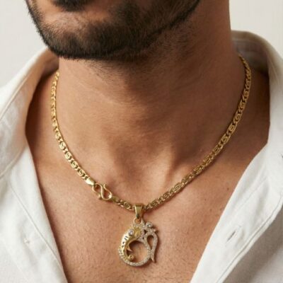 Embrace the presence of the "Remover of Obstacles" with this masterfully crafted gold-toned pendant. This piece artfully blends the sacred Om symbol with a stylized Ganesha silhouette, creating a radiant expression of wisdom, prosperity, and spiritual grounding.