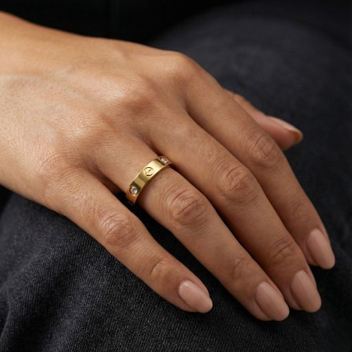 Embrace the peak of high-fashion industrial design with this impeccably crafted gold-toned band. Featuring a masterclass in clean, structural lines and high-mirror light play, this piece reinterprets traditional hardware motifs into the ultimate statement of modern luxury.