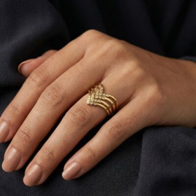 Embrace the peak of contemporary high-jewelry design with this impeccably crafted gold-toned statement ring. Featuring a masterclass in linear symmetry and brilliant light-play, this piece offers a bold, "triple-tier" silhouette that serves as the ultimate expression of modern luxury