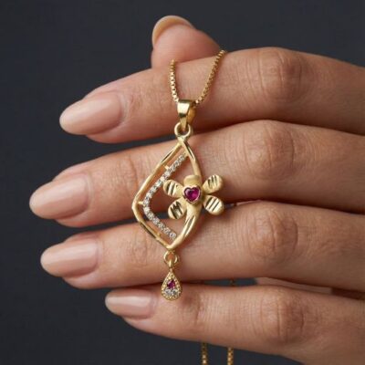 Embrace the peak of intricate botanical jewelry with this masterfully crafted gold-toned pendant. Featuring a masterclass in dynamic line-work and delicate light-play, this piece offers a sophisticated "garden-inspired" silhouette that serves as a radiant expression of modern, feminine elegance.