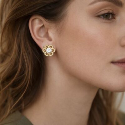 Embrace the peak of botanical luxury with these impeccably crafted gold-toned stud earrings. Featuring a masterclass in organic symmetry and brilliant light-play, this pair offers a sophisticated "bloom" silhouette that serves as the ultimate expression of modern, feminine elegance.