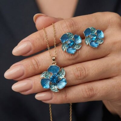 Step into a world of artisanal botanical beauty with this breathtakingly crafted jewelry set. Featuring a masterclass in enamel artistry and vibrant color theory, this piece offers a sophisticated "blooming" silhouette that serves as the ultimate expression of modern, nature-inspired elegance.