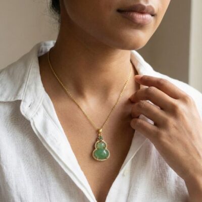 Embrace the peak of heritage-inspired luxury with this masterfully crafted gold-toned necklace. Featuring a masterclass in symbolic geometry and vibrant gemstone harmony, this piece offers a sophisticated "Wu Lou" silhouette that serves as the ultimate expression of modern prosperity and grace.