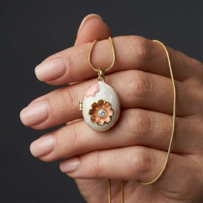 Step into a world of whimsical high-fashion with this breathtakingly unique locket. Featuring a masterclass in enamel artistry and vintage-inspired form, this piece offers a sophisticated "fabergé-style" silhouette that serves as the ultimate expression of modern, artisanal luxury.