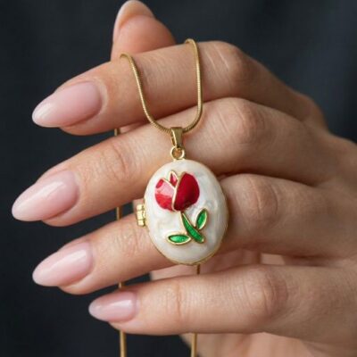 Step into a world of whimsical high-fashion with this breathtakingly unique locket. Featuring a masterclass in enamel artistry and vintage-inspired form, this piece offers a sophisticated "Fabergé-style" silhouette that serves as the ultimate expression of modern, artisanal luxury.