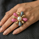 Step into a world of whimsical luxury with this breathtakingly artistic statement ring. Featuring a masterclass in texture, color, and sculptural form, this piece offers a vibrant "garden on your hand" silhouette that serves as the ultimate conversation starter for the modern fashion icon.